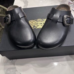 Saint Laurent Jimmy Clog Mules in black leather.